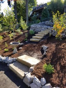 stone steps- rock walls- planting- drip irrigation- landscape design