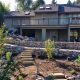 custom backyard landscaping- stone steps- rock walls- drip irrigation- gravel pathways- planting